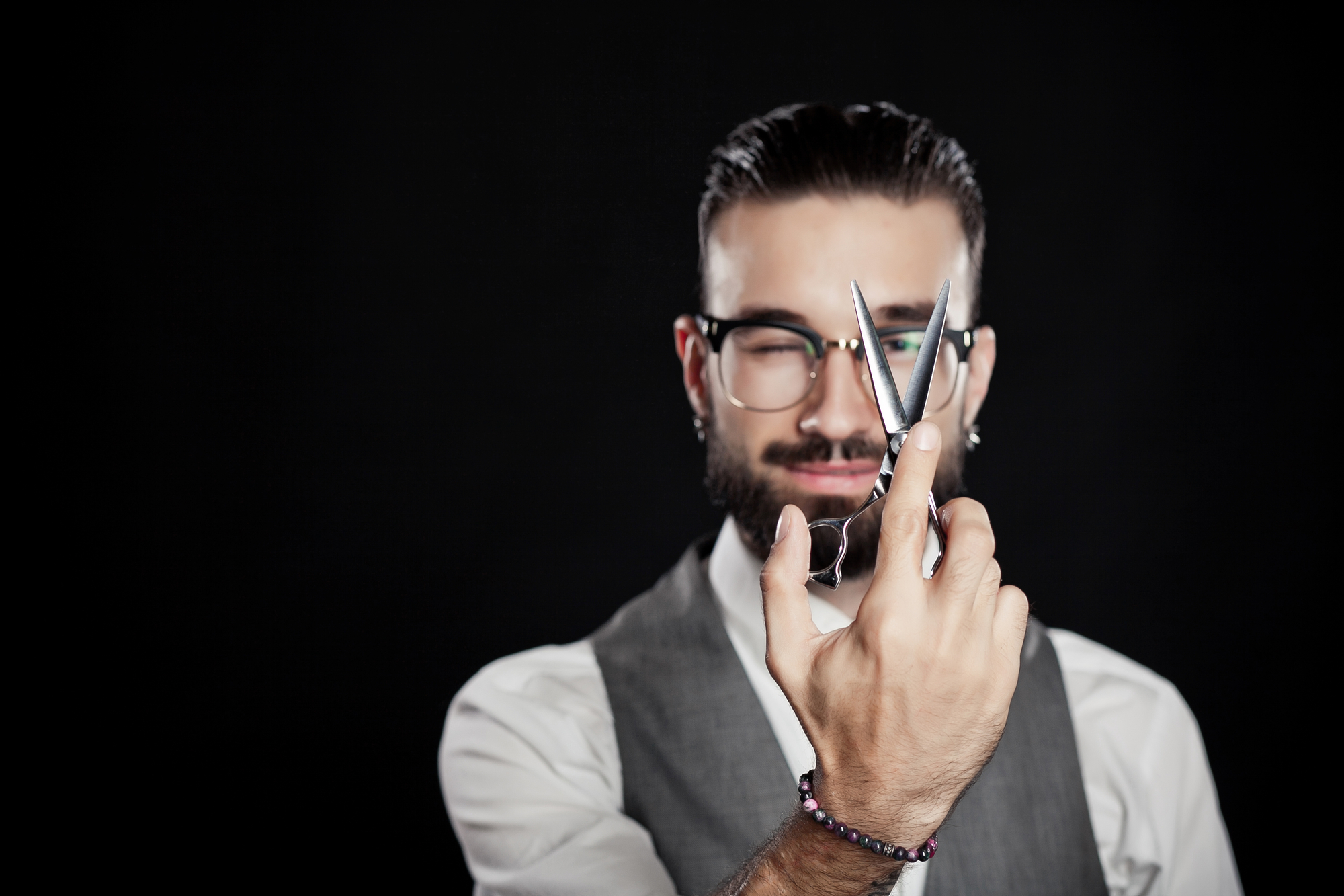 stylish hairdressers in the studio with scissors and comb